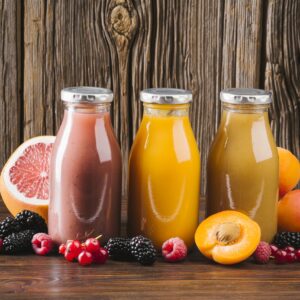 fresh-fruit-smoothies-wooden-background Promotie 3x Suc natural